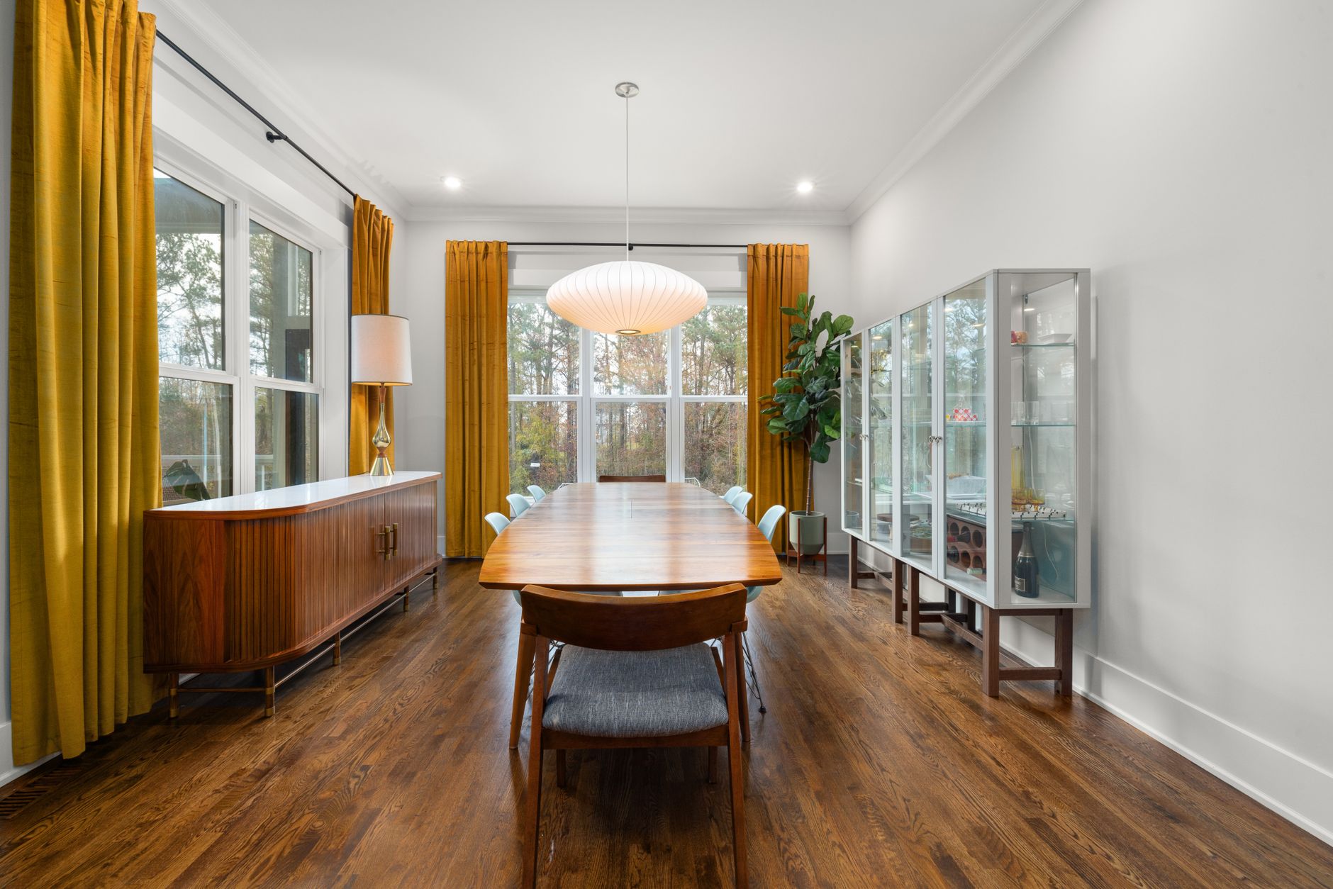 architectural detail of mid century home interior with clean lines oak floors and diffused natural light through translucent glass